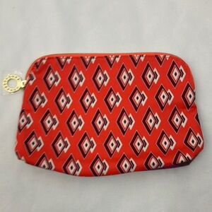 Estée Lauder recycled materials patterned orange cosmetics bag